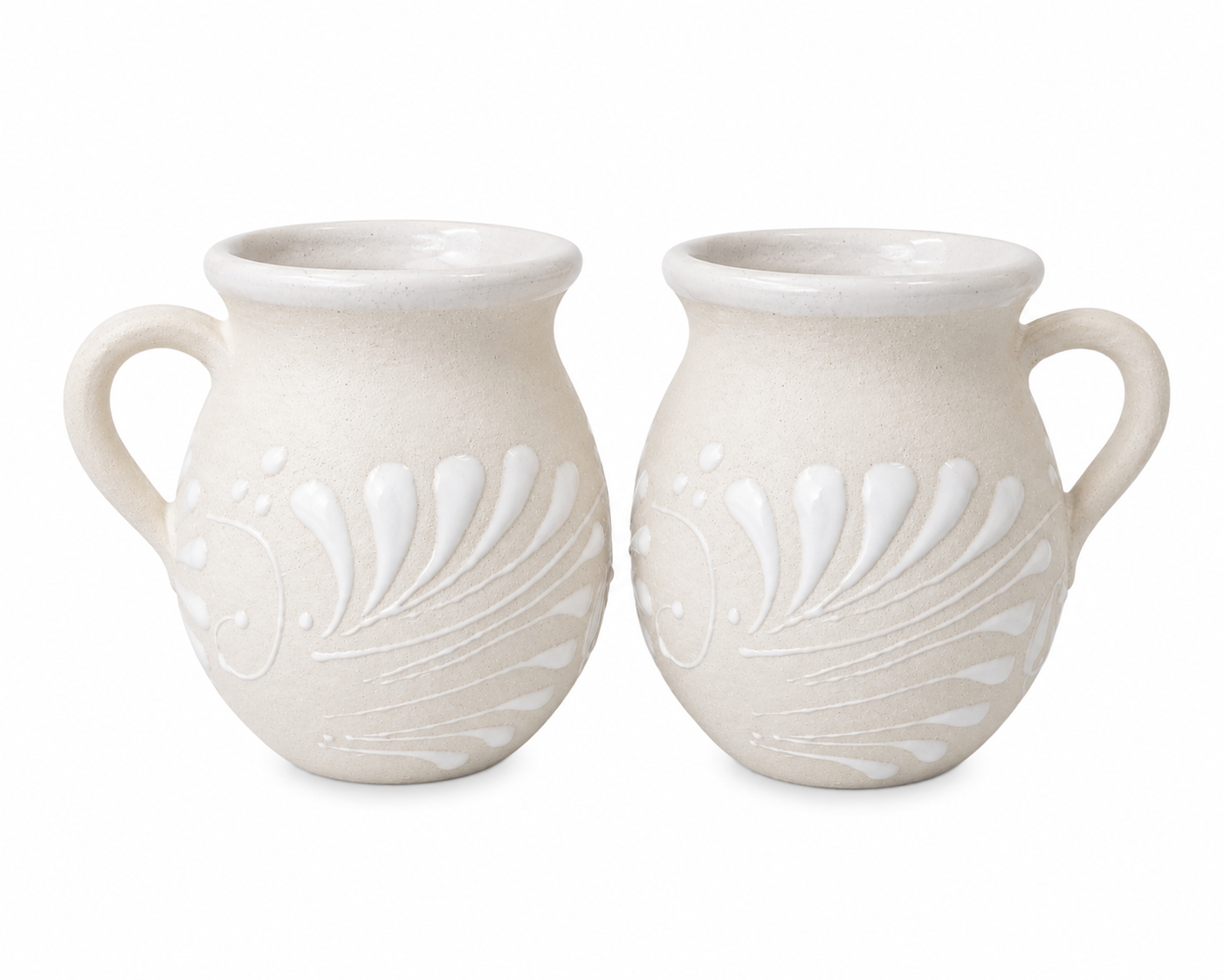 Two white ceramic vases with shell patterns on a white background